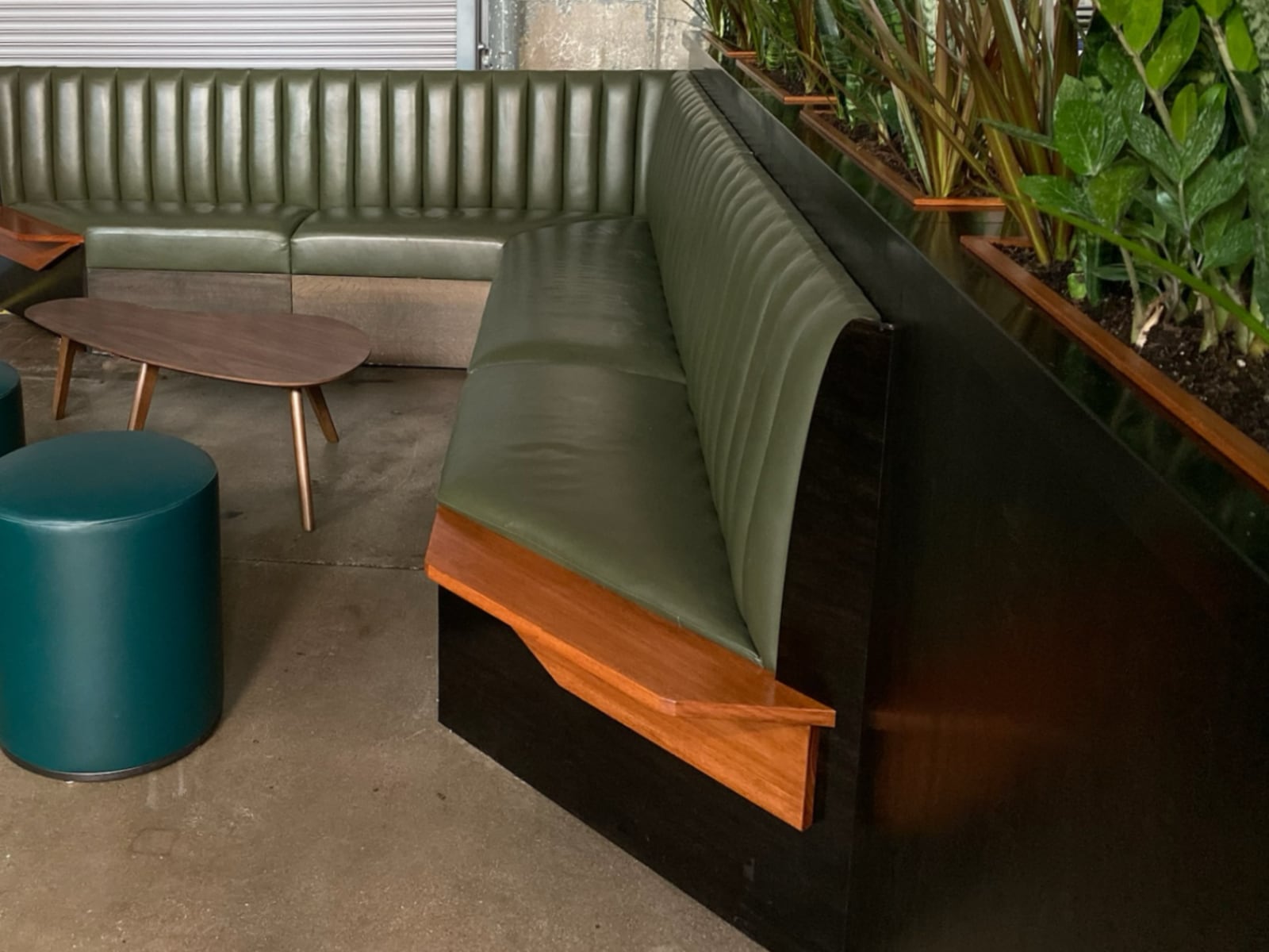 Clad banquette end with a custom end table